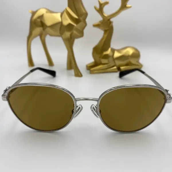 กรอบแว่น Coach เลนส์ Essilor 1.50 Varilux comfort max Transitions Amber2