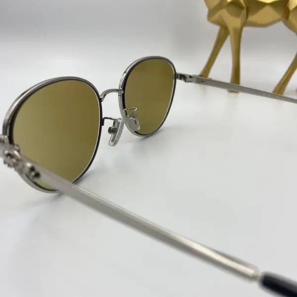 กรอบแว่น Coach เลนส์ Essilor 1.50 Varilux comfort max Transitions Amber3