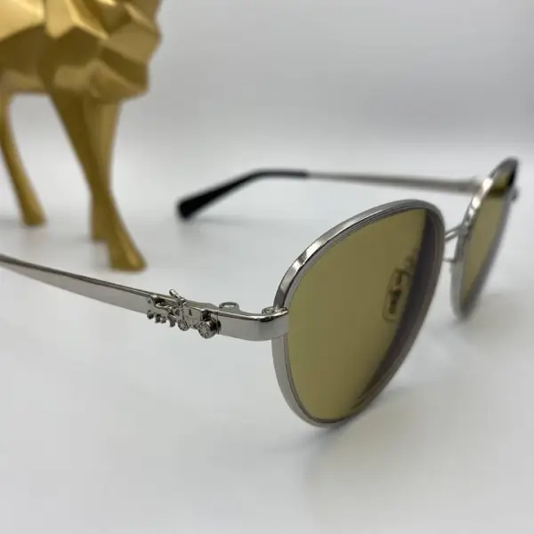 กรอบแว่น Coach เลนส์ Essilor 1.50 Varilux comfort max Transitions Amber4